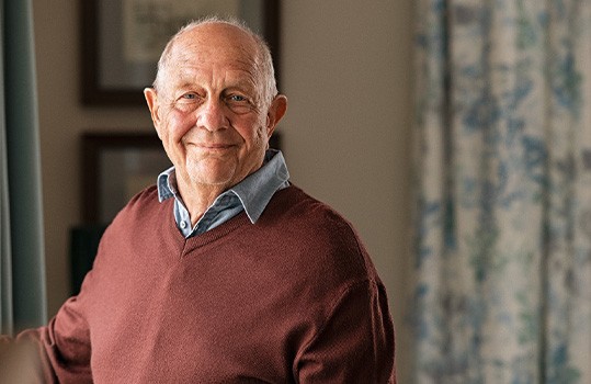 Closeup of senior man smiling at home