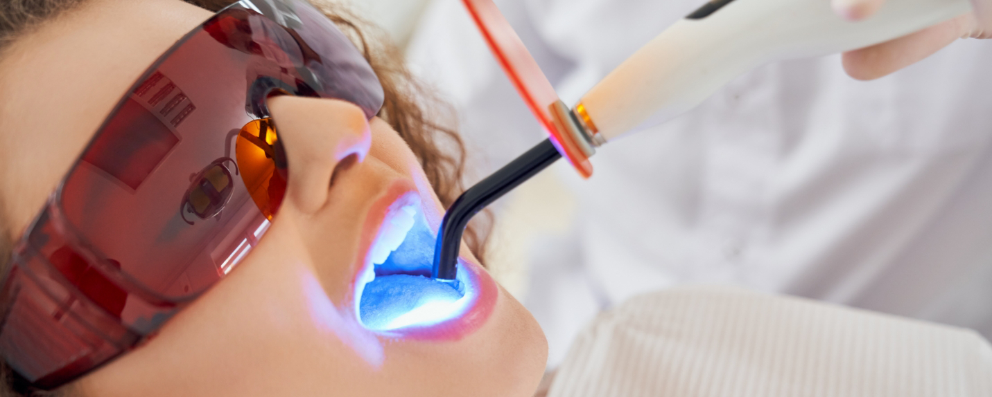 Woman receiving dental bonding with advanced dental technology in Montague