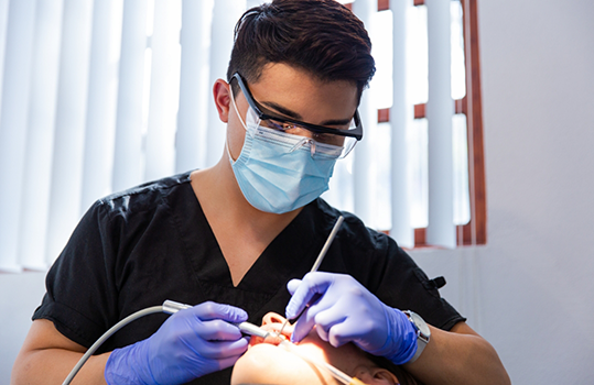 Dentist treating patient as part of preventive dentistry in Montague